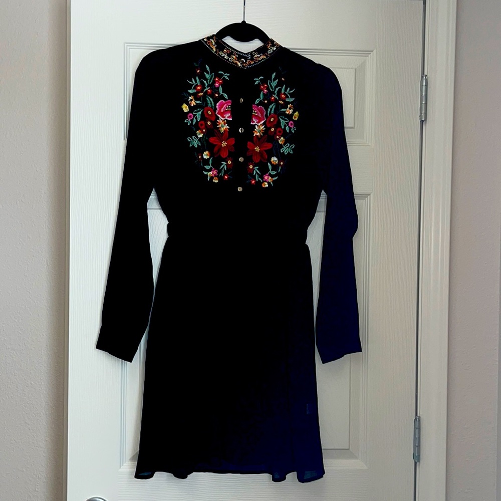 Black long sleeve dress with embroidered floral designs